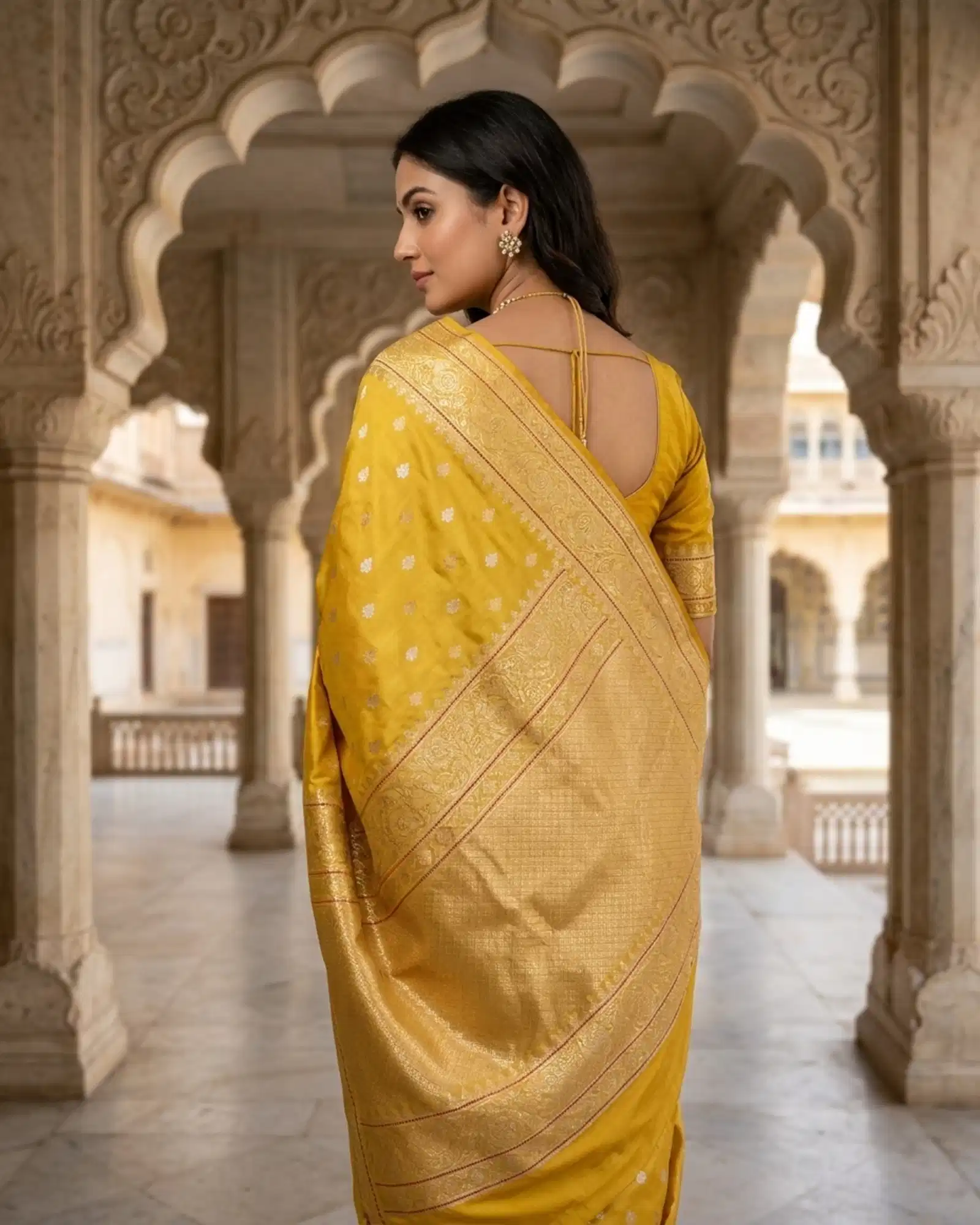 Mustard Yellow Banarasi Saree showing dense Gold Zari pallu